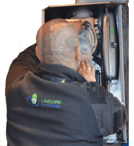 An engineer working on a gas boiler