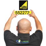 A gas engineer holding up the Landlord Certificates Gas Safety Register number